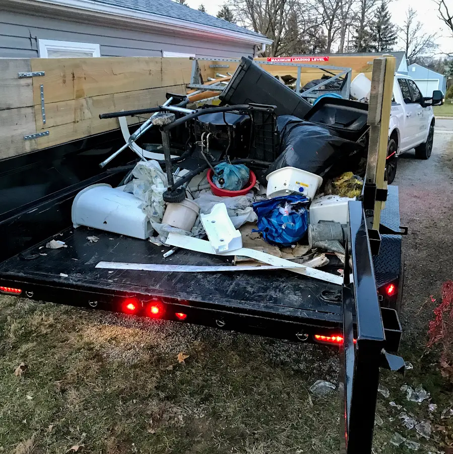 Roll-off dumpster delivered to a residential driveway in South Amboy